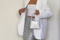 a classy pre-wedding party look with a white strapless top, a silver sequin midi, a white oversized blazer, a silver bag and statement earrings