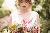 02 The bride was wearing a moody floral crown and a bouquet, and her dress was relaxed boho-chic