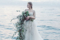 03 One of the brides was wearing an ethereal cream wedding dress with an illusion sweetheart neckline and half sleeves