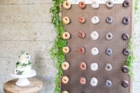 03 a simple pegboard with hooks decorated with greenery as a donut bar