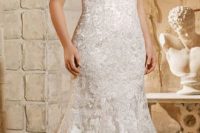 04 lace beaded illusion neckline wedding gown with cap sleeves and a mermaid silhouette