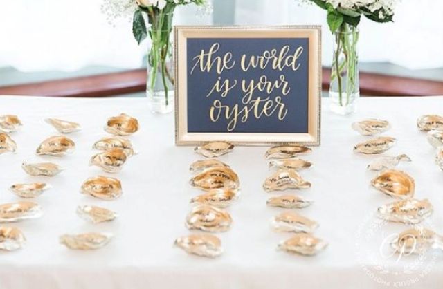 oyster shell escort cards with calligraphy