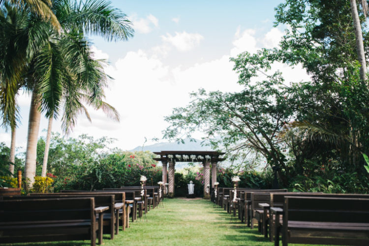 The ceremony and reception took place in a lush tropical garden