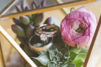 06 a terrarium filled with succulents and flowers as a ring box