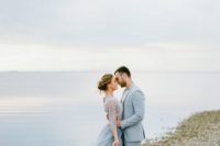 07 light blue groom’s suit and a flowy light blue wedding dress with sleeves for a sea-loving couple