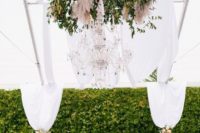 07 walls covered with greenery and a large greenery and flower chandelier