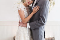 08 The bride was rocking an illusion plunging neckline dress with lace appliques and cap sleeves