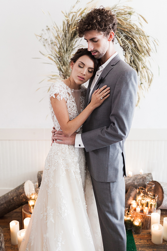 The bride was rocking an illusion plunging neckline dress with lace appliques and cap sleeves