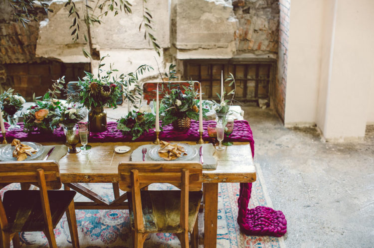 The table was laid with a wool magenta table runner, lots of greenery and cool plates