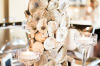 08 a table centerpiece designed with oyster shells is great idea for a reception on the water
