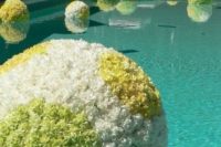 08 floating flower spheres in the pool for cute decor