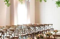 08 neutral florals for lining up the aisle and an oversized greenery chandelier