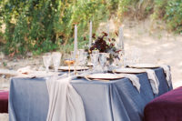 09 The tablescape was decorated in blue and blush, with gold rim glasses, tableware and dark flowers
