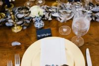 09 beautiful nautical table setting with an oyster garland, navy cards and flowers