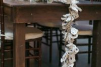 10 an oyster garland in a metal bath, driftwood and candles