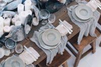 11 grey fabric for each place setting, large shells and candles