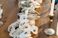 12 an oyster shell garland, candles and blue glasses are right what you need for an island wedding