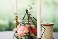 12 chic centerpiece with a dark metal terrarium filled with eucalyptus and peonies and candles