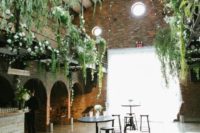 12 hang greenery and flowers over the whole reception to trun even an industrial space into a garden