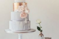 12 marble and white wedding cake with a copper tier and flowers