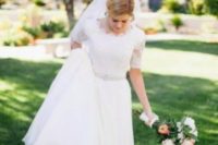 12 refined lace wedding dress with short sleeves and an embellished belt