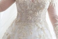 13 ornately embellished bridal gown with long sheer sleeves