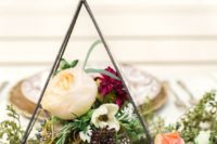 13 simple metal terrarium with greenery and flowers inside