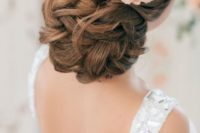 14 elegant twisted and curly wedidng updo with peach-colored blooms
