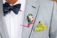 14 light grey suit, a white shirt, a dark bow tie and bold elements