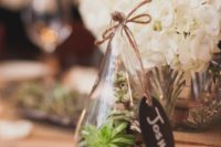 14 mini-terrariums with succulents as place cards and favors