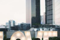 15 accentuate your rooftop venue with oversized LOVE letters