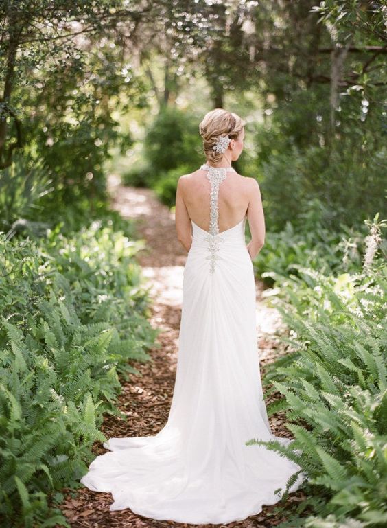 elegant wedding dress with a train and a jeweled racerback