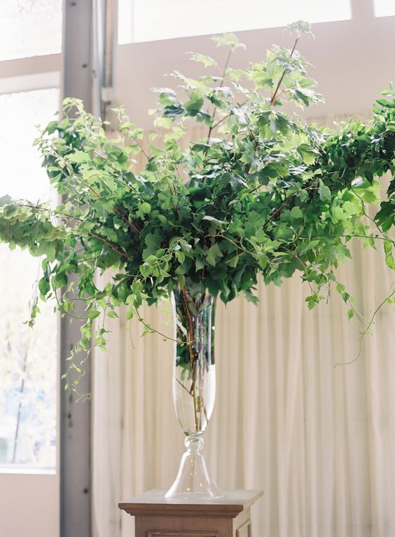 such lush greenery arrangements will easily turn your venue into a garden and won't cost a lot