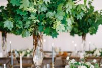 16 oversized greenery decor and smaller centerpieces with white flowers