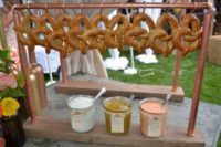 16 pretzel station with hanging pretzels and dipping sauces