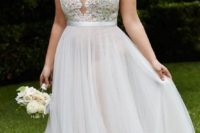 17 illusion plunging neckline wedding gown with a lace bodice and a plain skirt