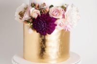 18 white and gold wedding cake topped with fresh blooms