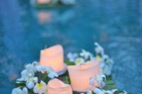 19 floating bambbo mats with fresh flowers and candles