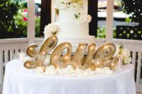 20 let a marquee LOVE sign light up a cake table and make it the focal point of the reception