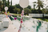 23 candles, balloons and tassels for decorating the pool