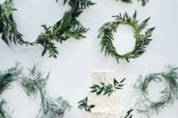 23 create a backdrop of greenery wreaths for your cake or dessert table