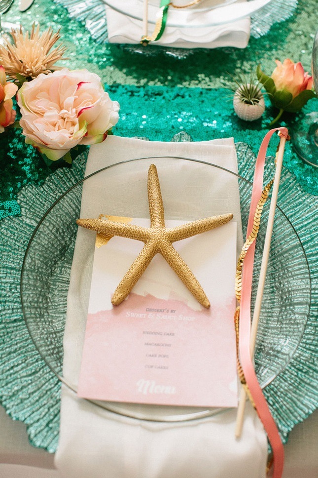 green sequin tablecloth with a star fish and shells