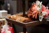 23 rustic cookie stand decorated with fresh blooms