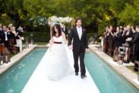 24 an aisle put right over the pool is an amazing idea for your ceremony