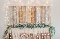 24 lit up sweetheart table and cool LOVE marquee letters