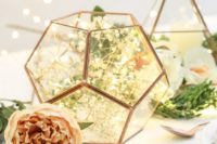 25 copper and glass pentagonal terrarium filled with lights is a cute idea