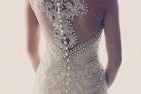 26 heavily jeweled wedding dress with an illusion racerback on buttons