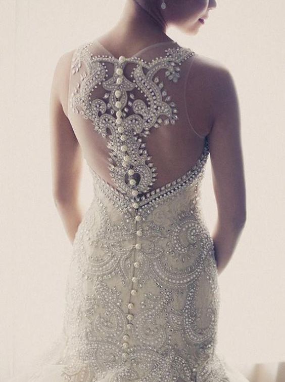 heavily jeweled wedding dress with an illusion racerback on buttons