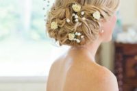 26 low twisted bridal updo with baby’s breath and garden roses