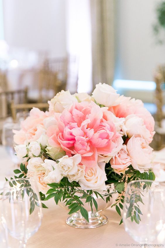 put lush floral centerpieces on the tables for a light garden feel